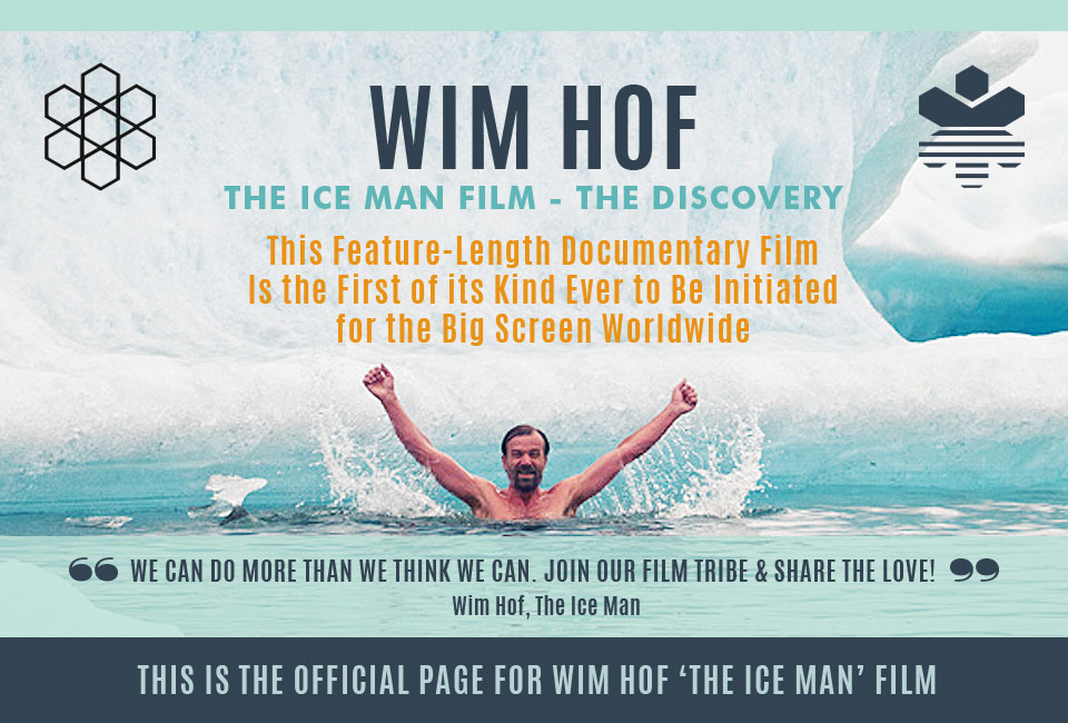 Wim Hof rising from icy water with arms raised